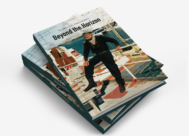 A stack of paperback books titled 'Beyond the Horizon' featuring a cover photo of an older sailor standing confidently on a ship deck, with the sea and harbor in the background. 